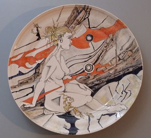 Platter with rock, rust and female figure